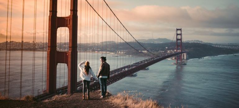 Couple looking over San Francisco, one of the most attractive cities in Bay Area for young couples