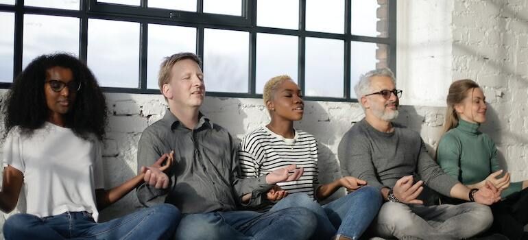 a group of people meditating