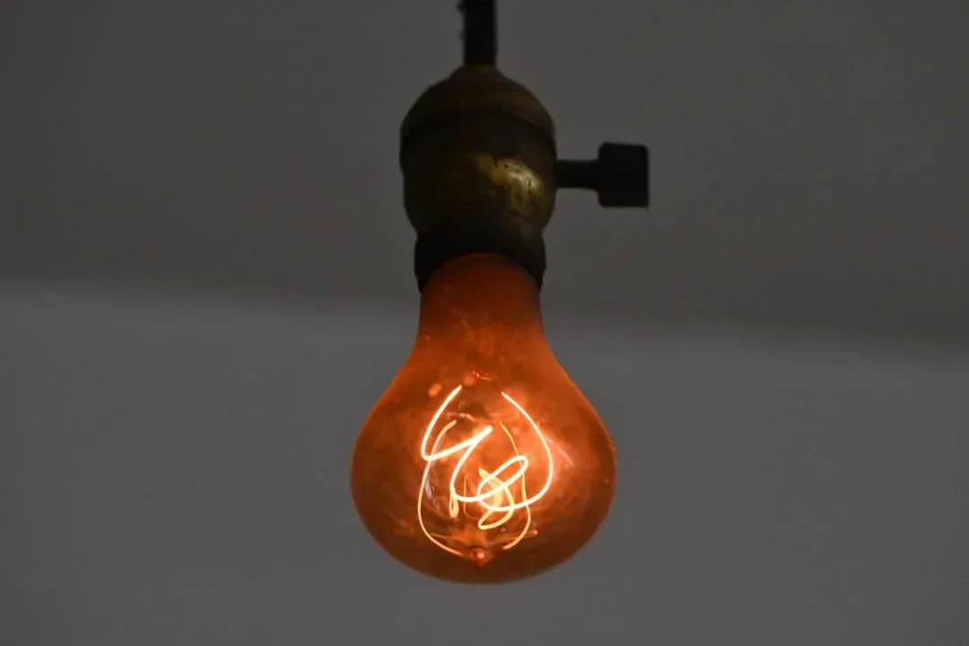 The Livermore Centennial Light — glowing since 1901 and still burning. Close-up of the Livermore Centennial Light, an antique glowing light bulb known as the longest-lasting light bulb in the world.