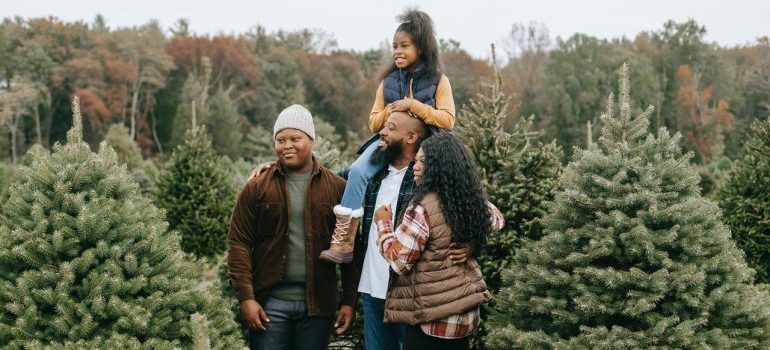 A family visiting one of the best Bay Area Christmas getaways to get a Christmas tree