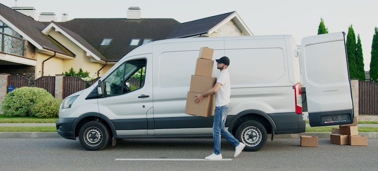 Man carrying boxes.