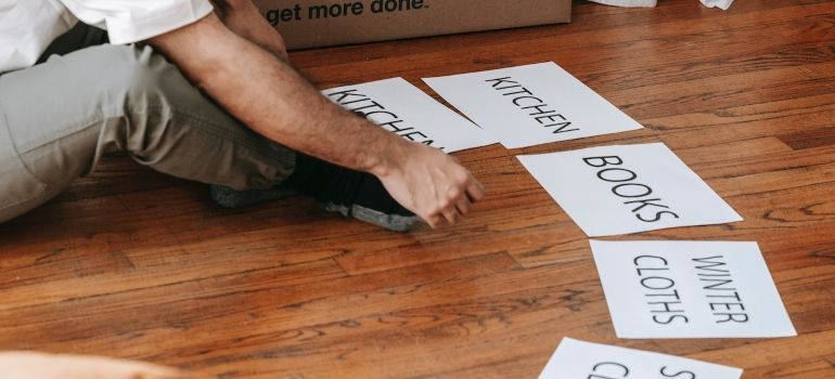 papers with labels on the floor