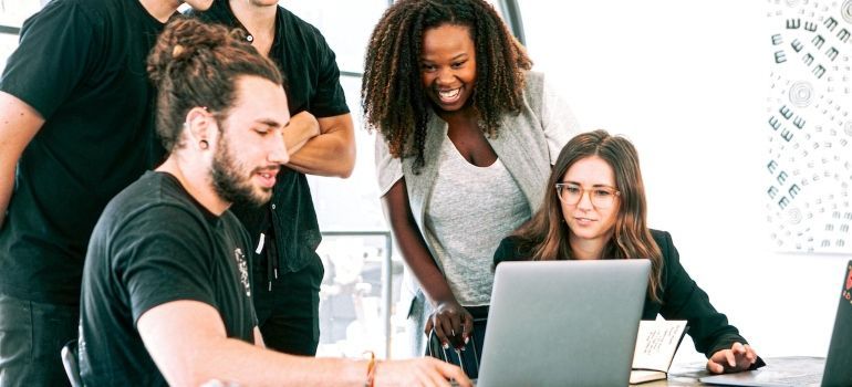 coworkers working on laptop