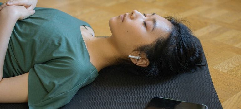 a woman relaxing while listening to music