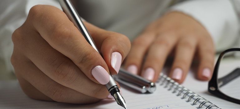 A woman writing a list