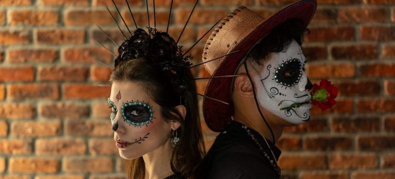 two people wearing Halloween makeup