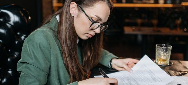 Woman signing a document