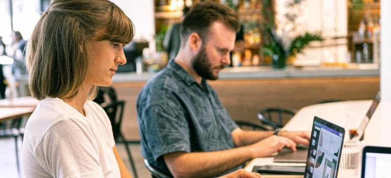 A woman and a man doing a research before they move from Daly City to San Leandro