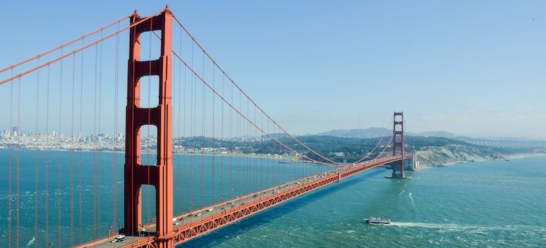 Golden Gate Bridge, during a sunny day;