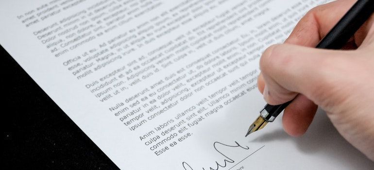 a hand signing contract