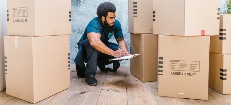 A mover writing down what to wear on moving day