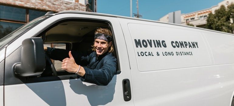 A man driving a moving van