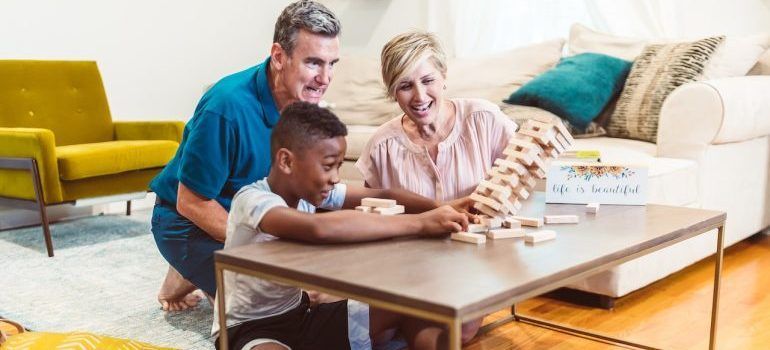 Parents playing with their child