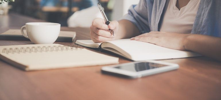 Girl writing in the notebook 