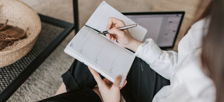 Woman writing in a notebook