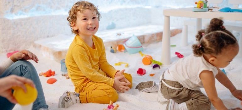 toddlers having fun playing on the floor