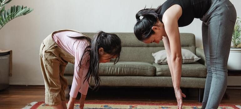 Mother and daughter stretching