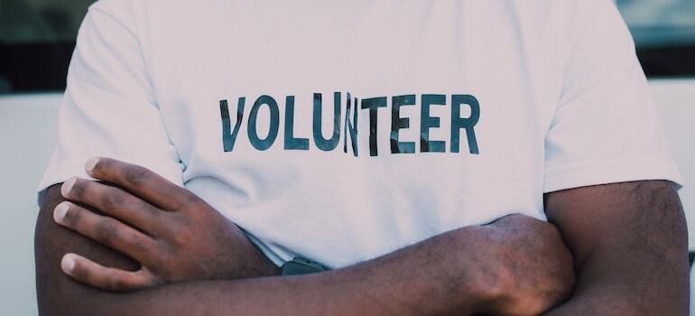 A volunteer wearing a white shirt