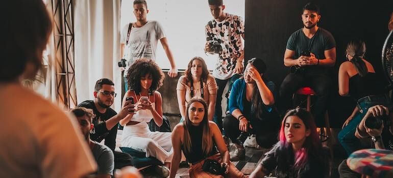 A group of people listening to a speaker