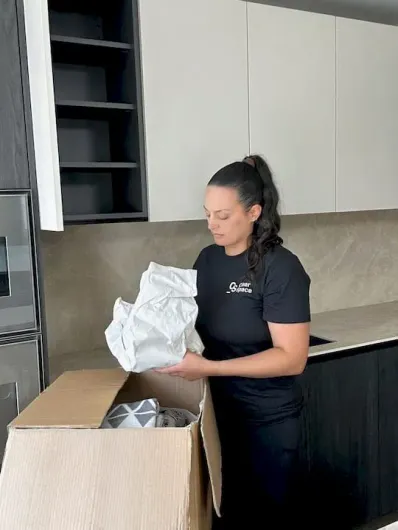 Professional unpacking service in Hertfordshire organising kitchen items from moving boxes