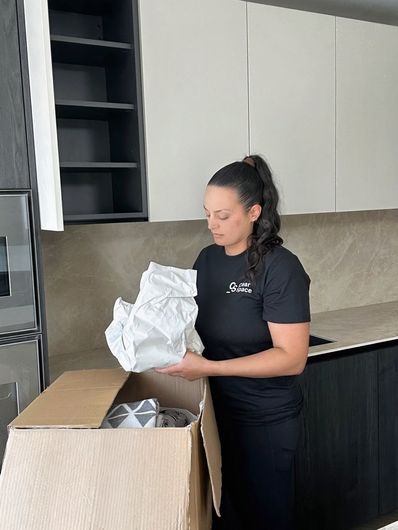 Professional unpacking service in Hertfordshire organising kitchen items from moving boxes