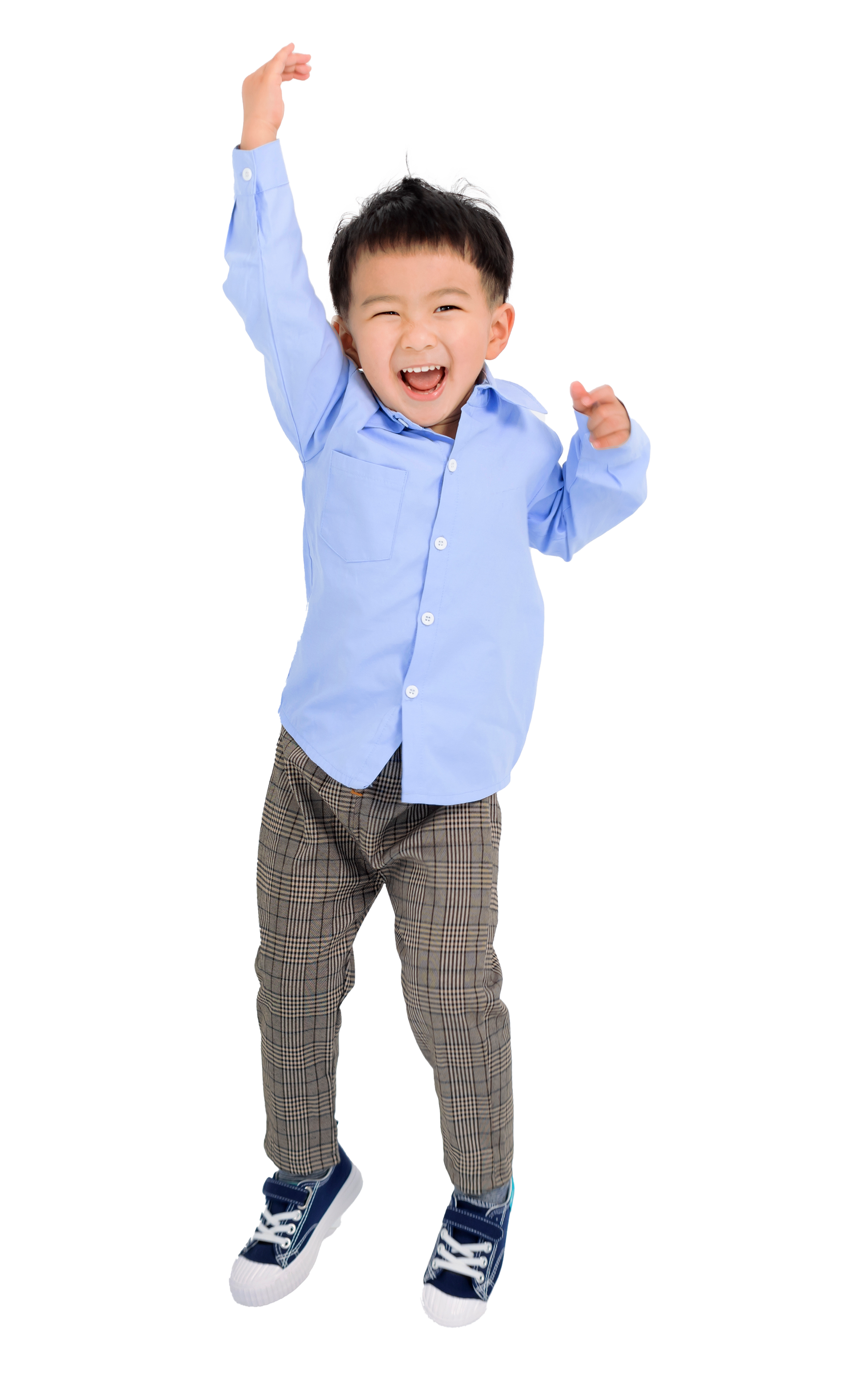 Happy child jumping, arm raised, wearing blue shirt and patterned pants.