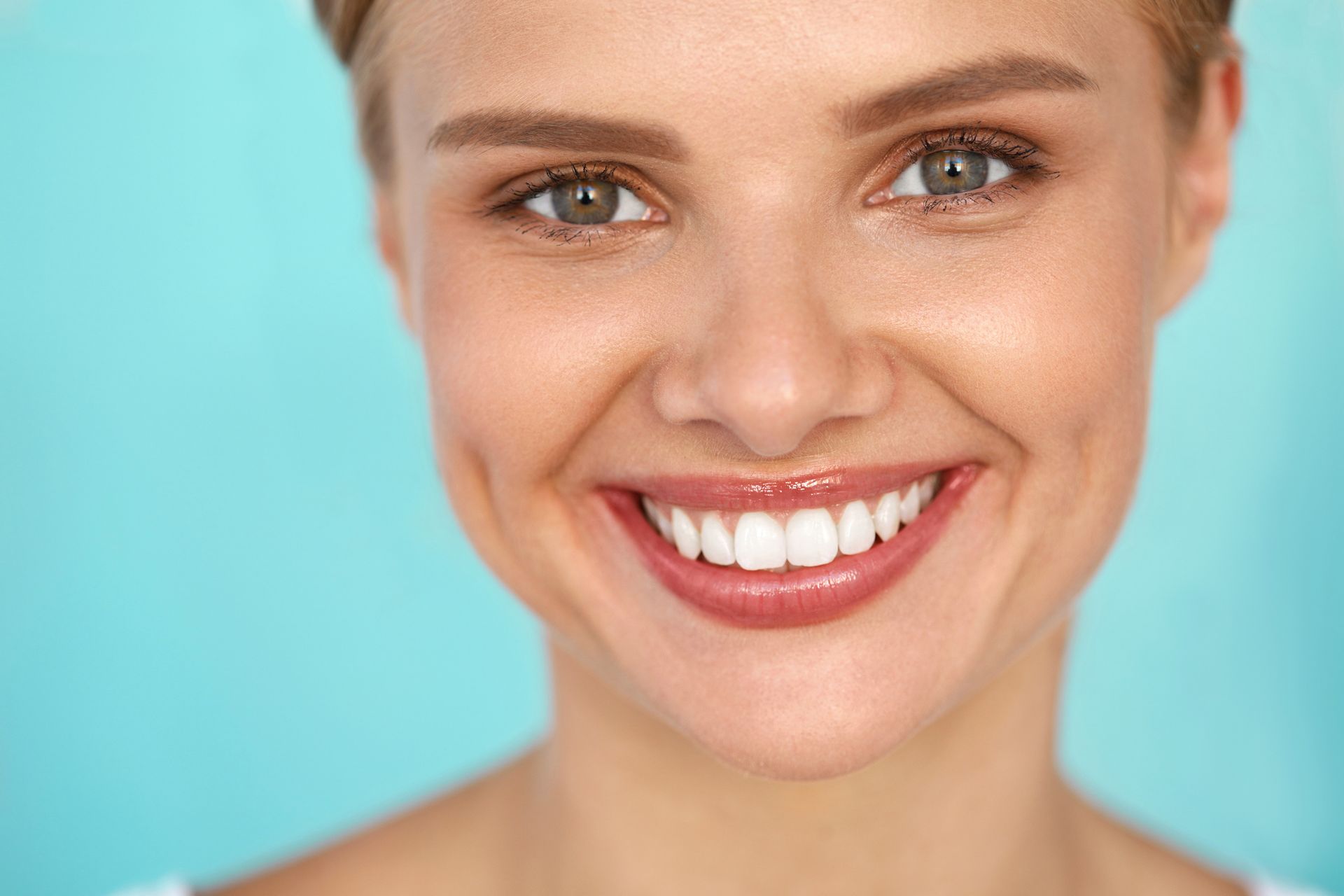 Beautiful smile closeup of happy young woman with perfect white teeth. Beautiful smile closeup of happy young woman with perfect white teeth.