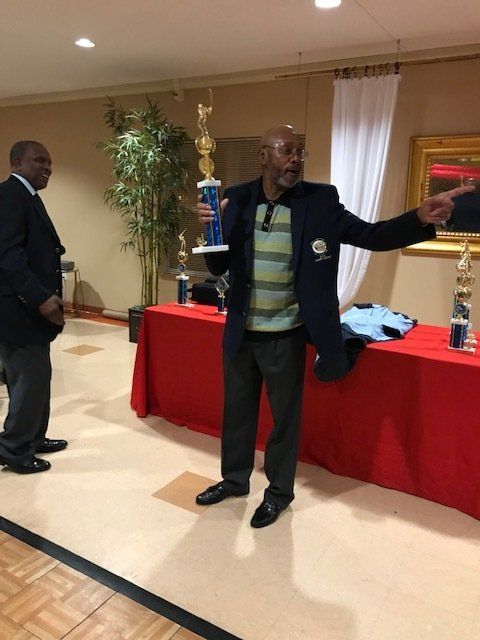 Man Holding A Trophy — St. Louis, MO — Par or Better Golf Club