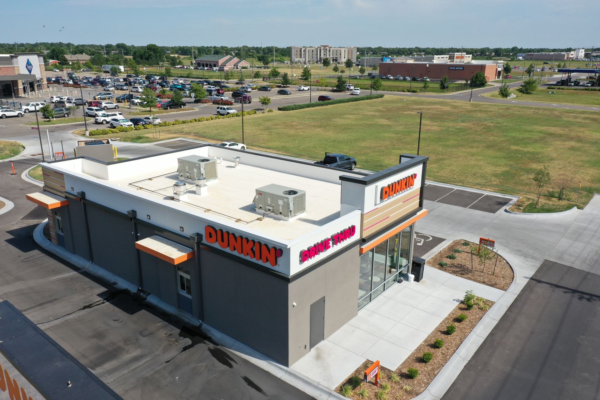 Retail roofing project for Dunkin' featuring a new white TPO membrane by Bloyer & Sons.