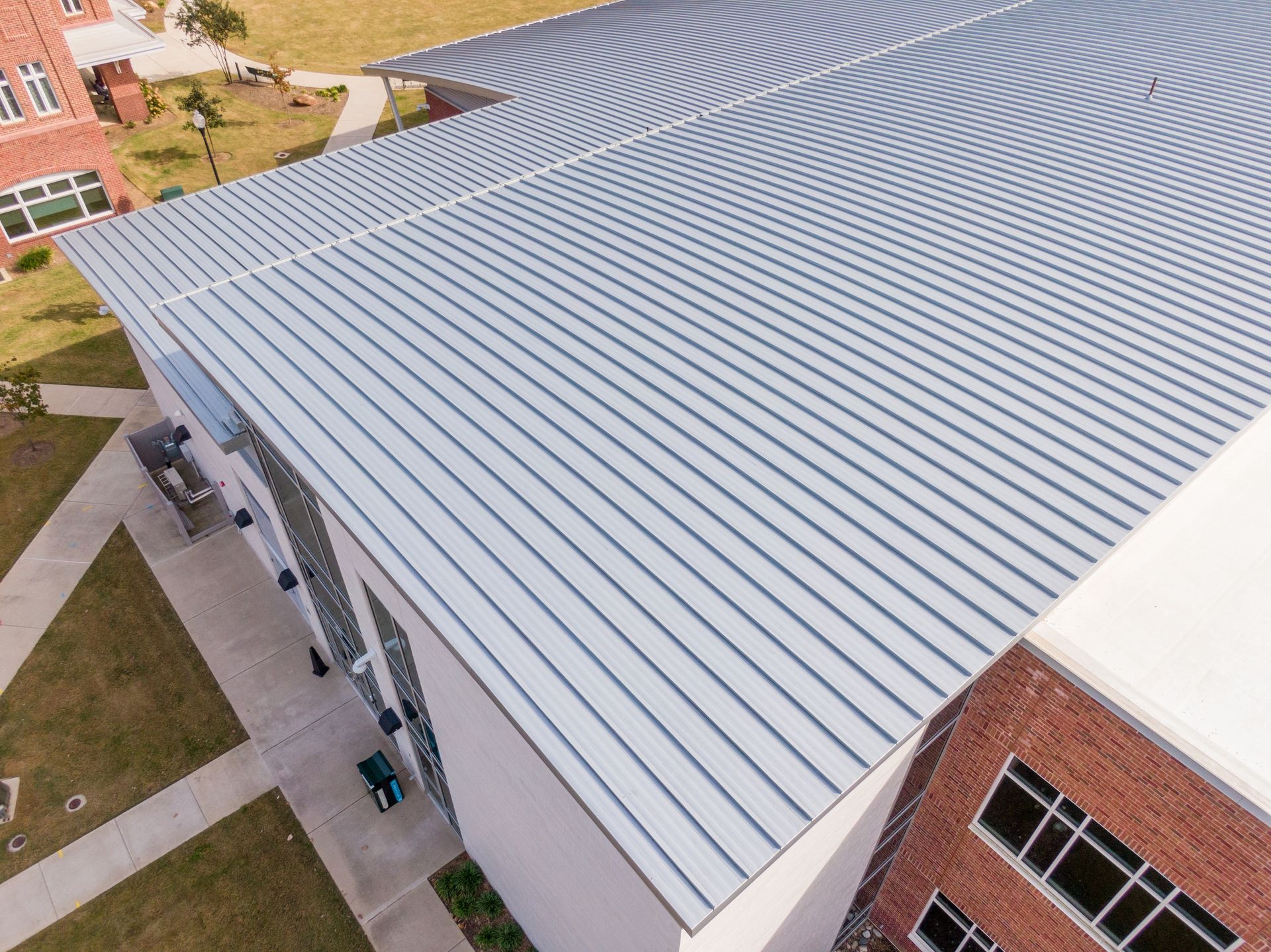 Professional standing seam metal roof inspection by Bloyer & Sons, serving commercial properties in Wichita, KS.
