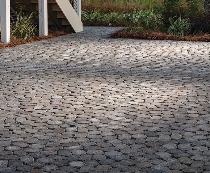 Curved Belgard paver patio installed by Outdoor Transformations in Palm Valley, FL.