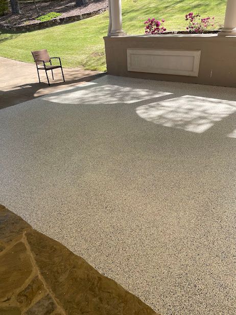Outdoor Transformations' crew pressure washes a paver driveway in St. Augustine, restoring its original clean look.