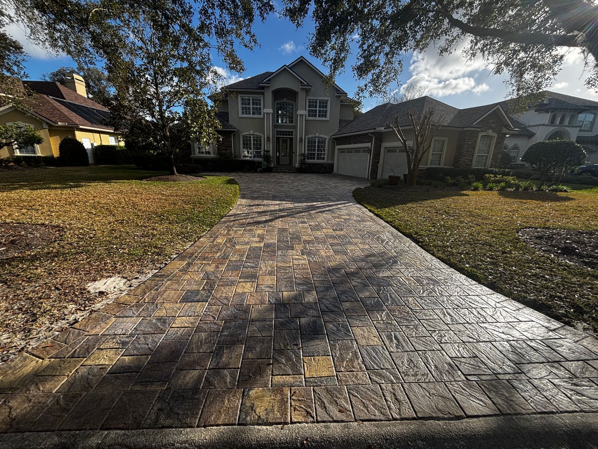 Outdoor Transformations pressure washed a concrete driveway in St. Augustine, FL, removing dirt and stains.