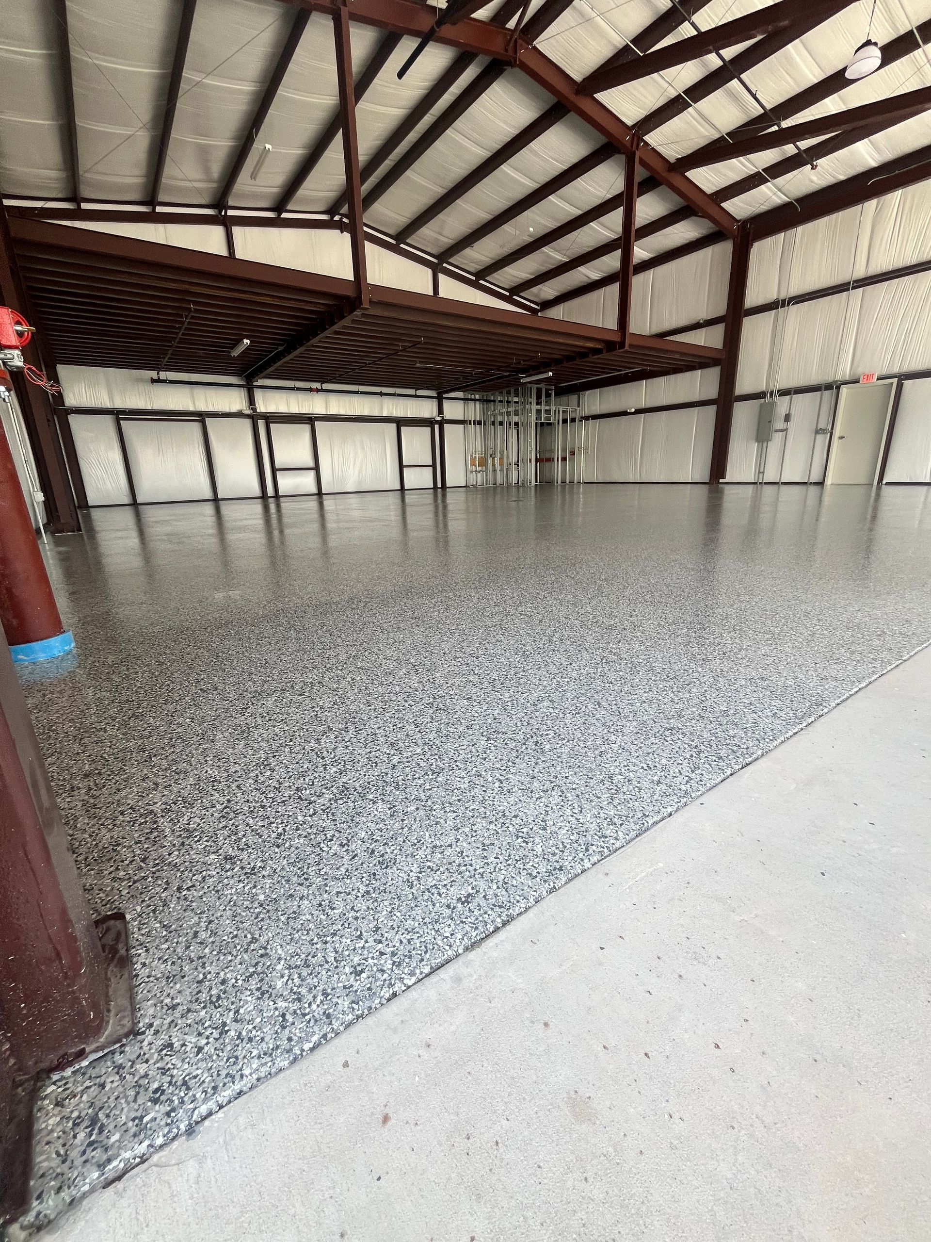 after an new install of epoxy flooring in a garage St Augustine by Outdoor Transformations