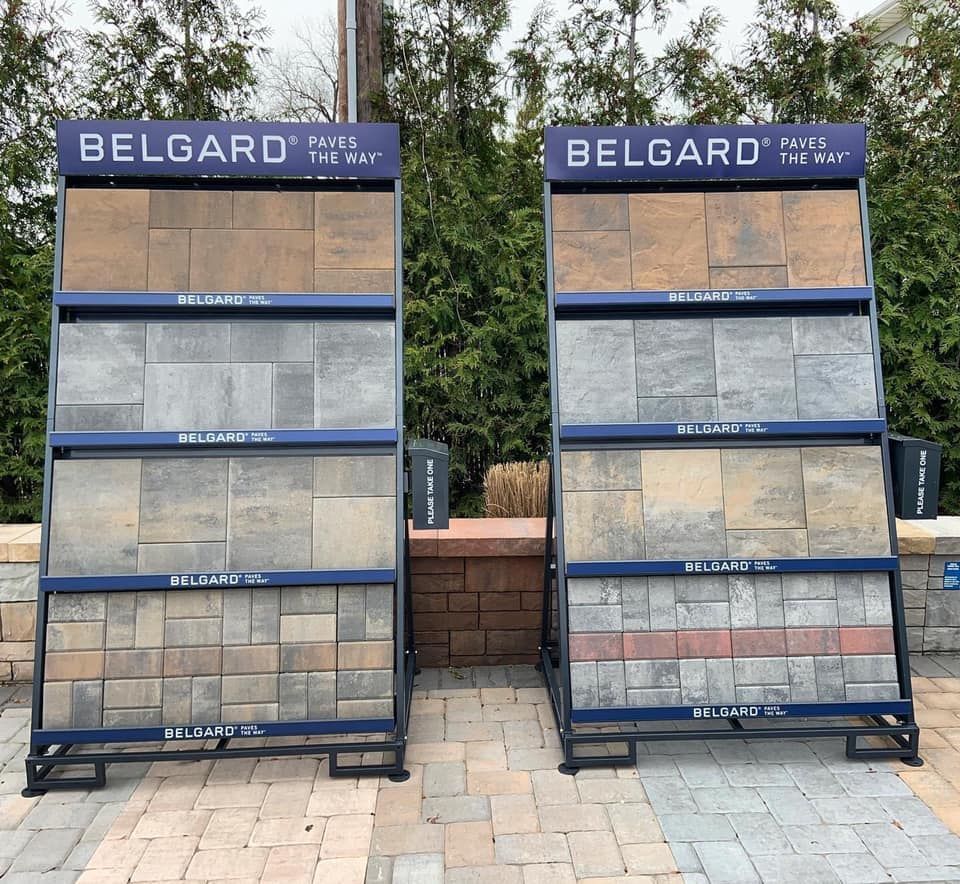 Two display stands with different texture and design of bricks from Belgard brand.