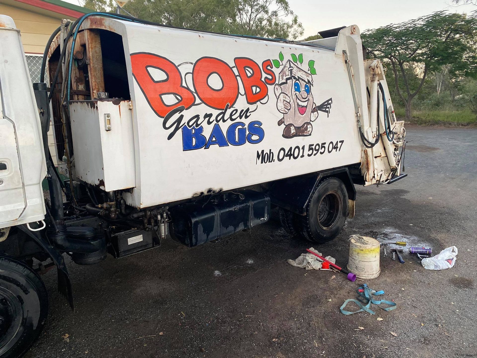 White Bob's Garden Bags Garbage Truck With Cartoon Logo — Bob’s Trailer Trash in Rockhampton, QLD