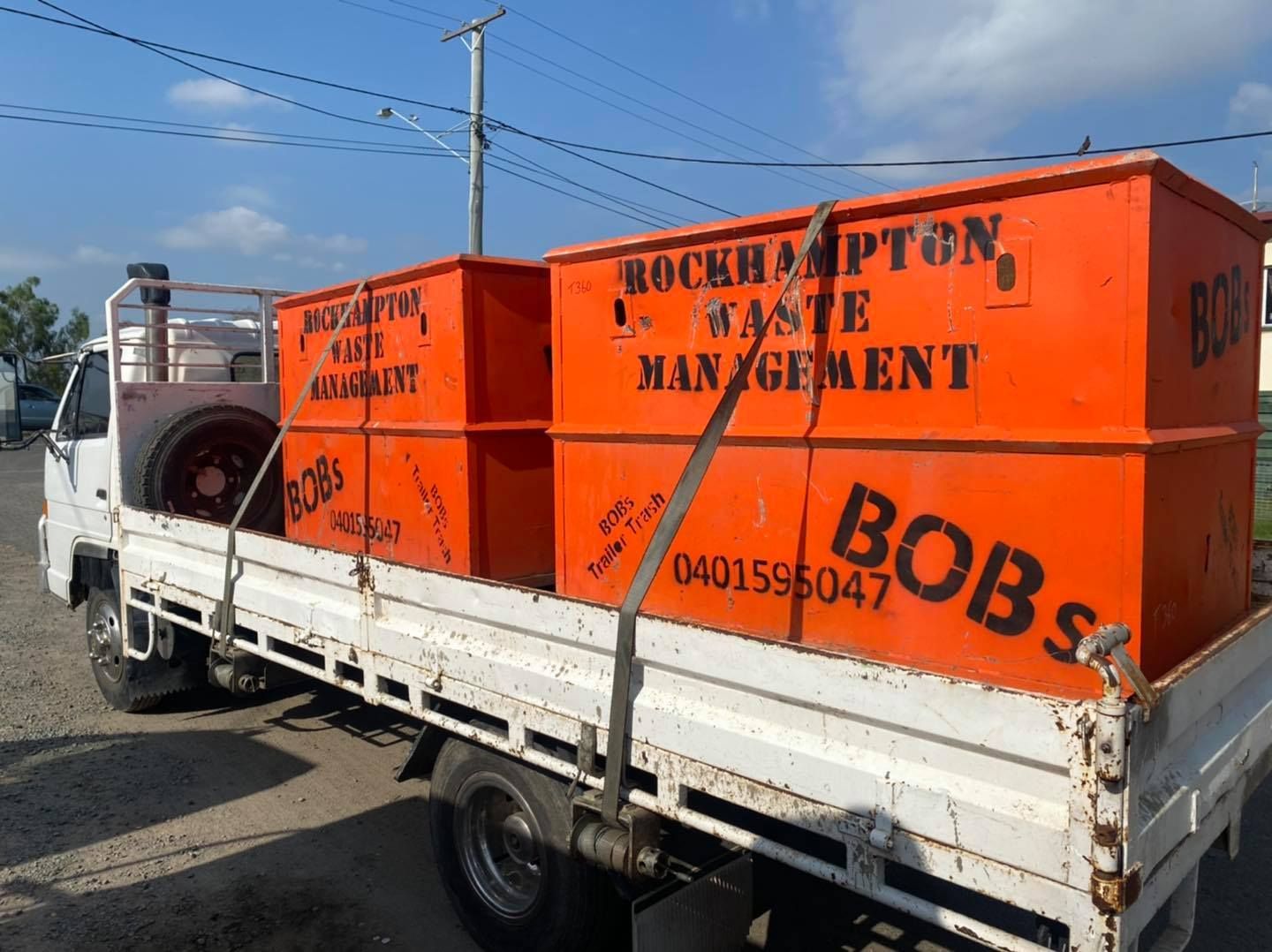 Orange Waste Bins on a White Truck — Bob’s Trailer Trash in Gracemere, QLD