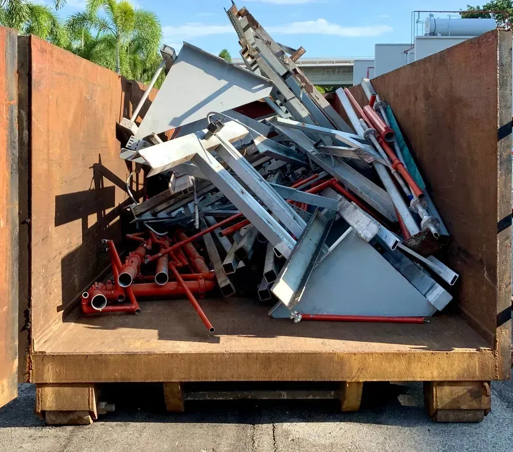 Metal Scrap in a Rusty Brown Container — Bob’s Trailer Trash in Yeppoon, QLD