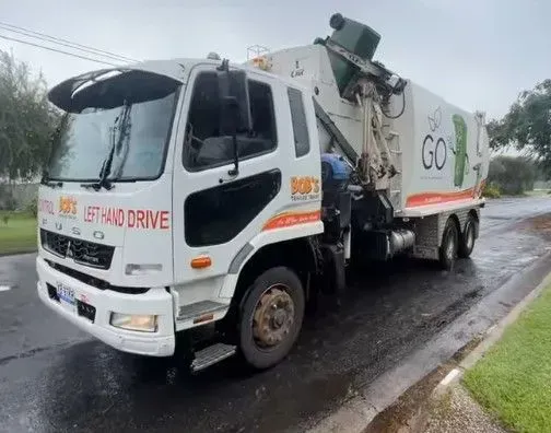 White Garbage Truck on a Wet Street — Bob’s Trailer Trash in Rockhampton, QLD