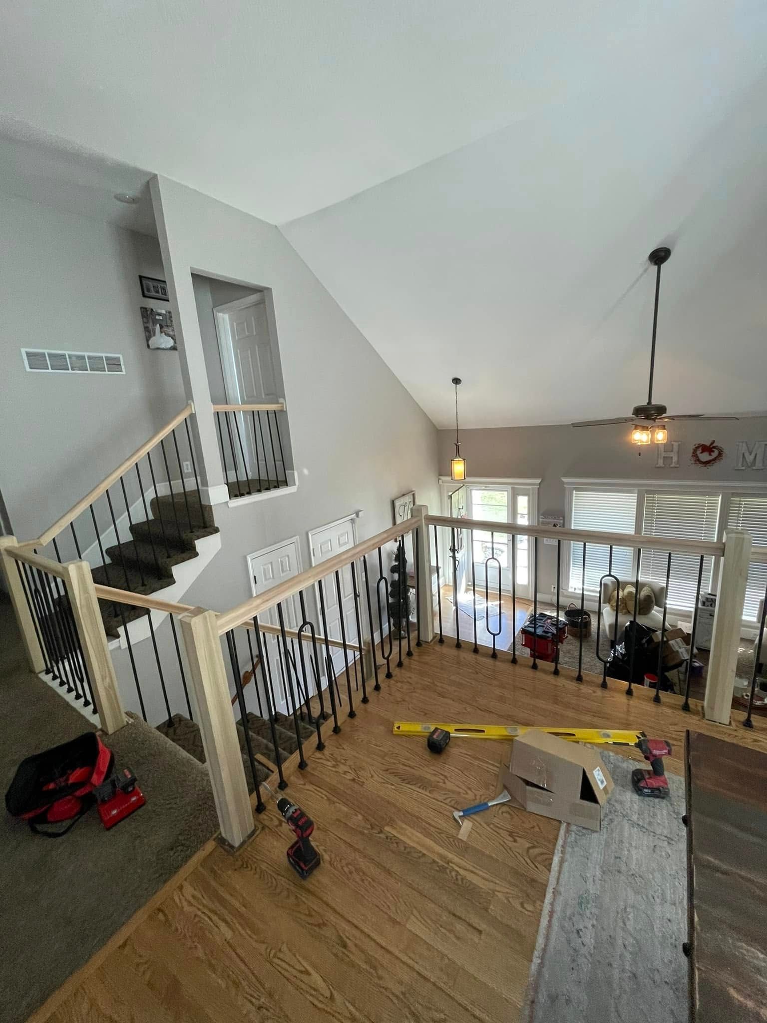 An aerial view of a house with stairs and a ceiling fan.