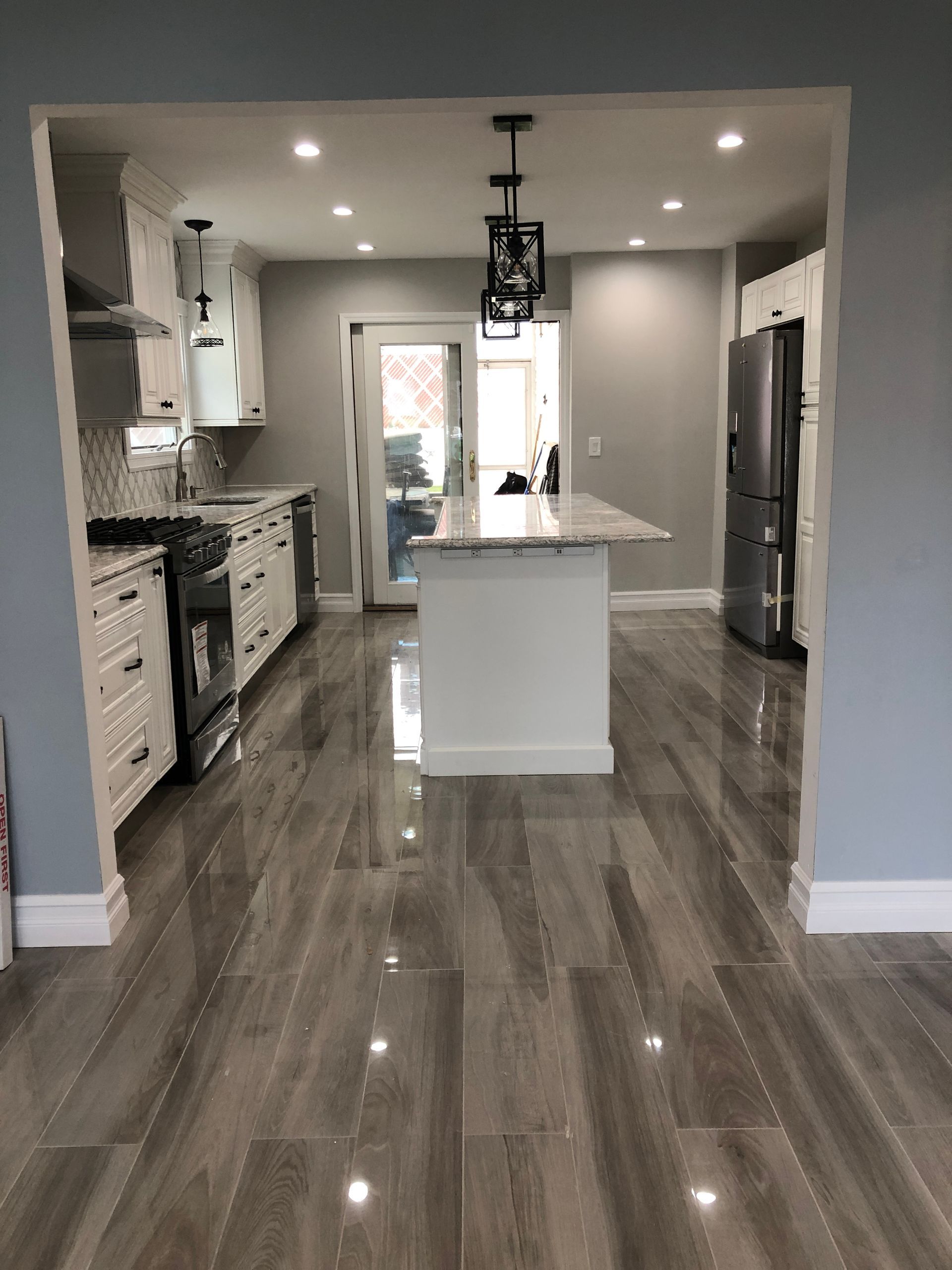 A kitchen with a large island in the middle of the room.