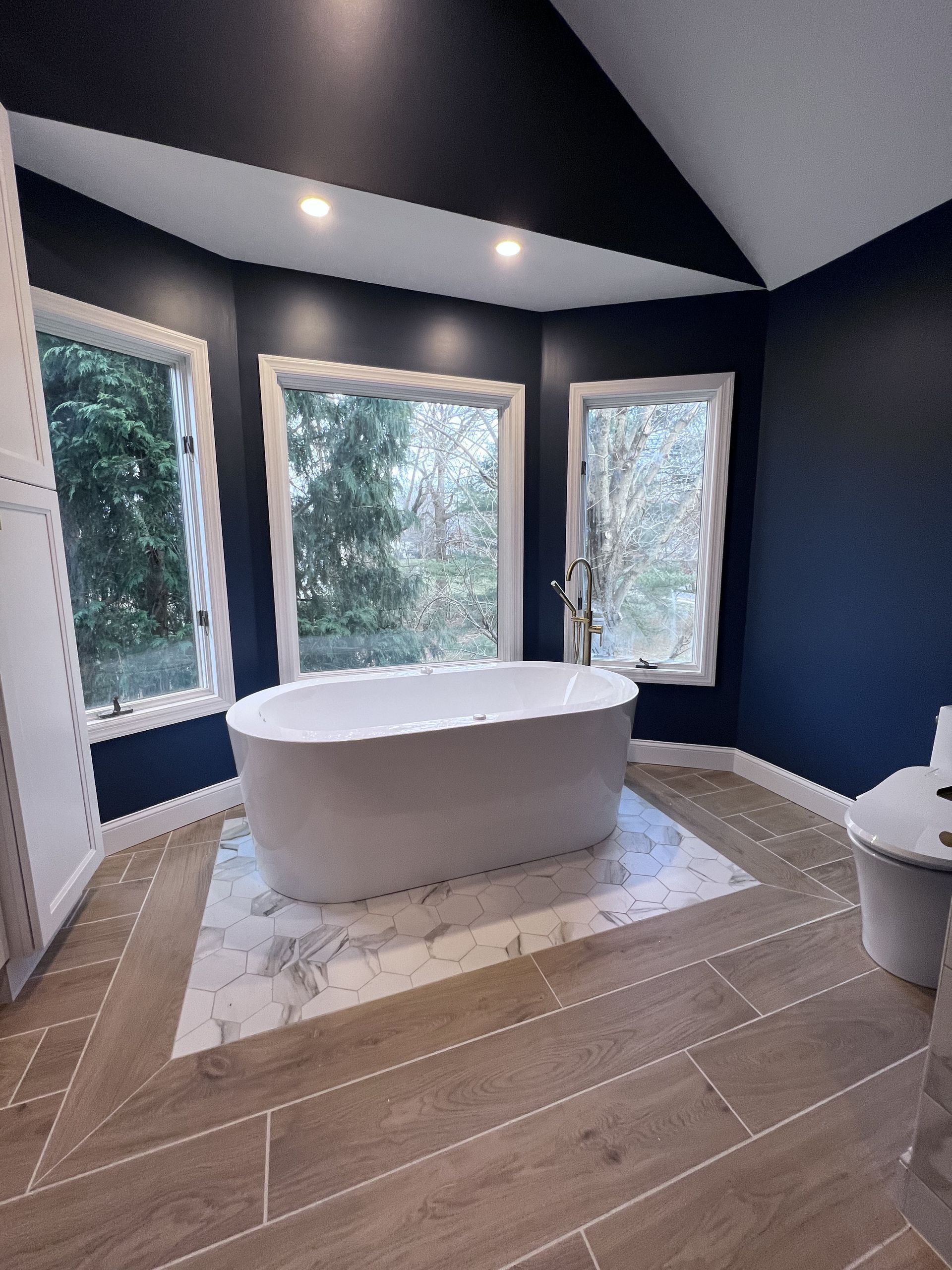 A bathroom with a bathtub and a toilet.