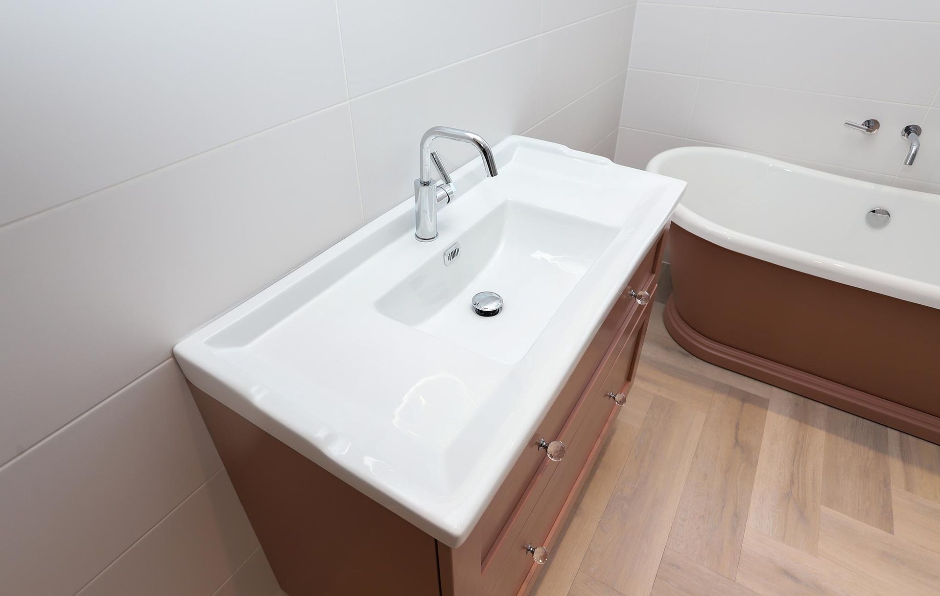 A bathroom with a sink and a bathtub.