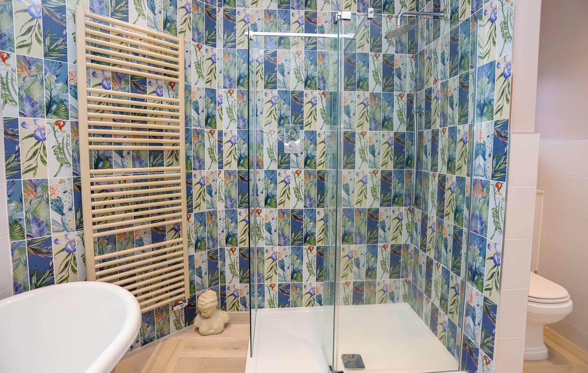 A bathroom with a walk in shower and a bathtub