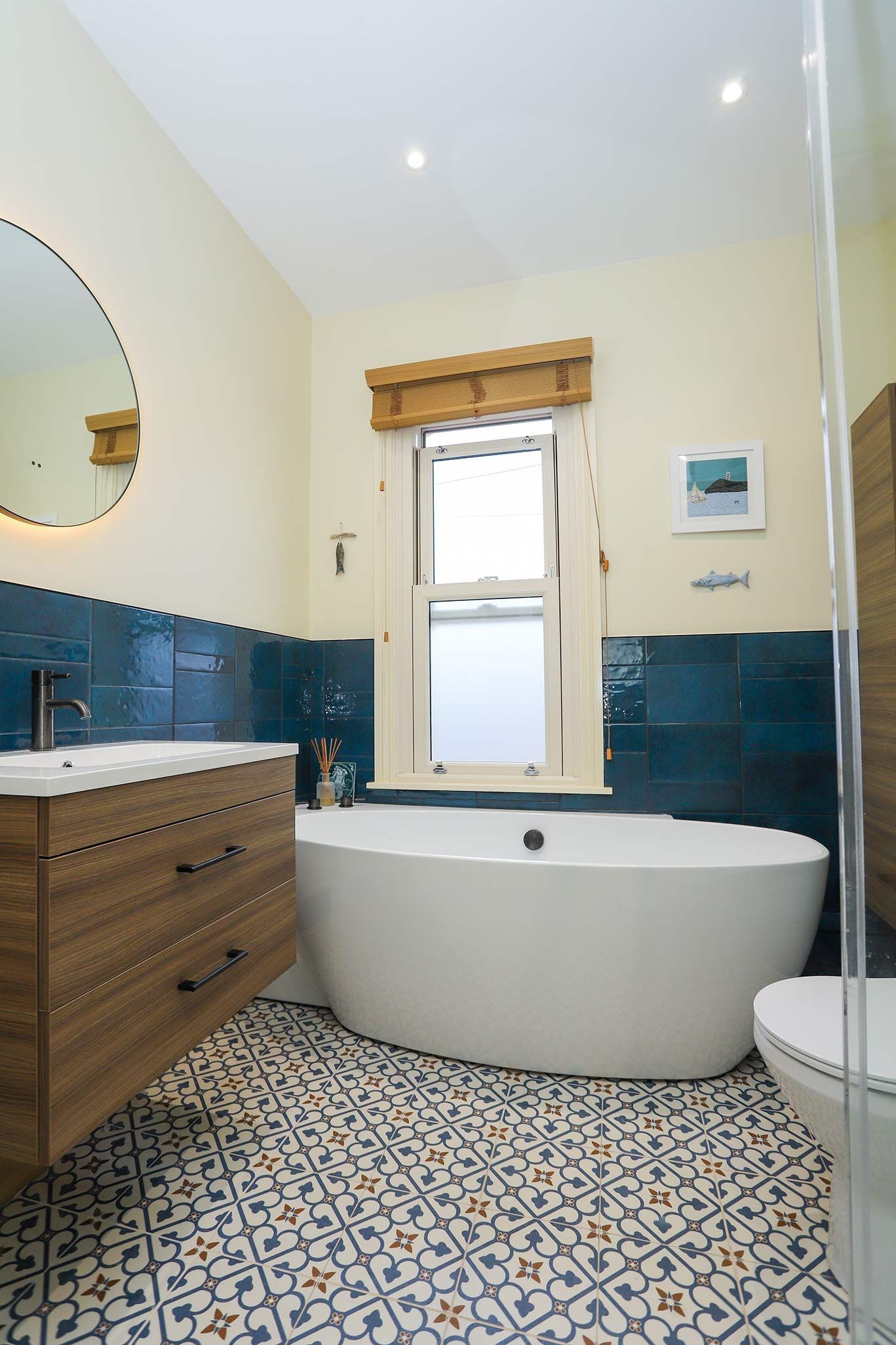 A bathroom with a bathtub a sink and a toilet