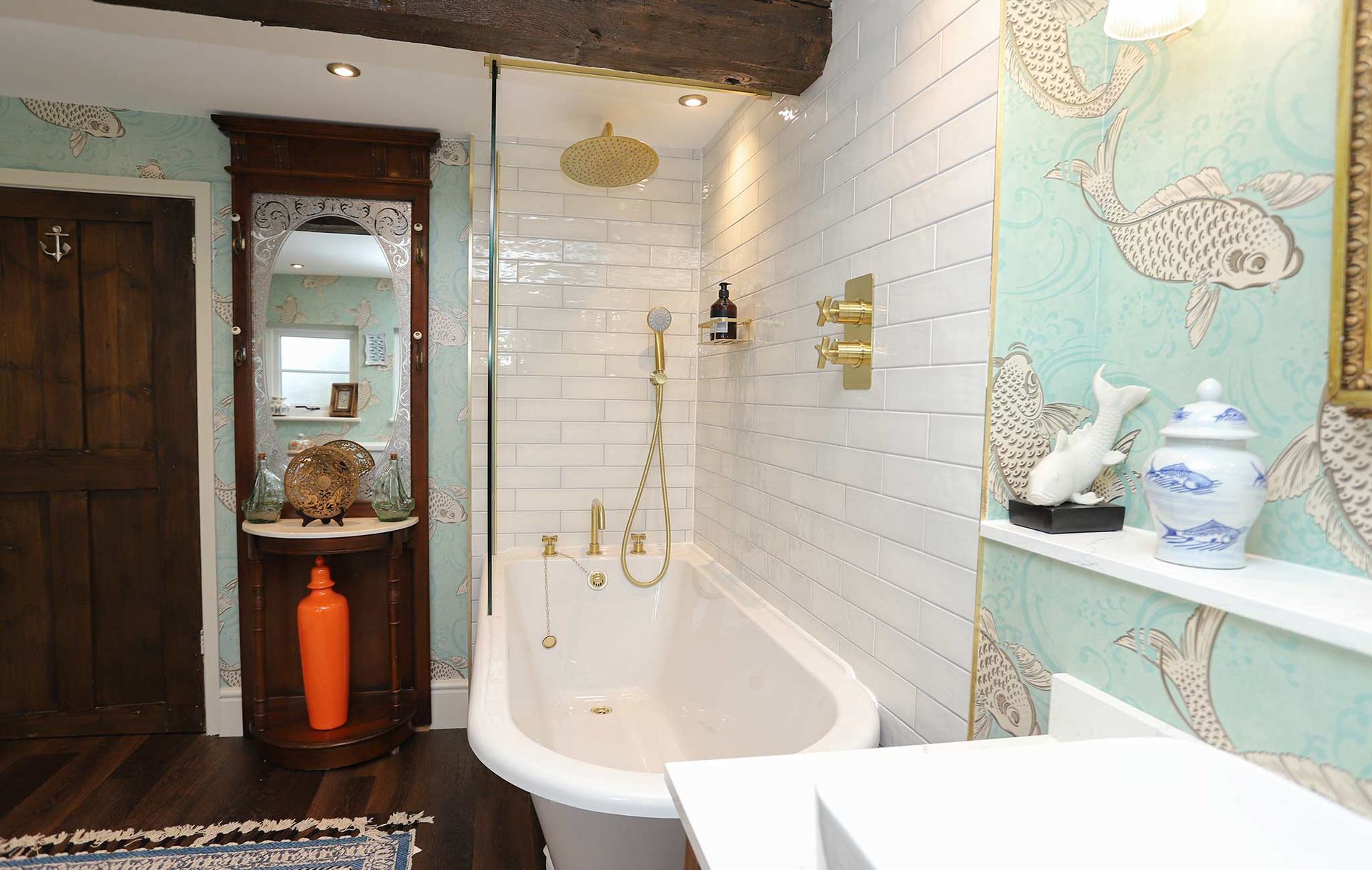 A bathroom with a bathtub a sink and a mirror