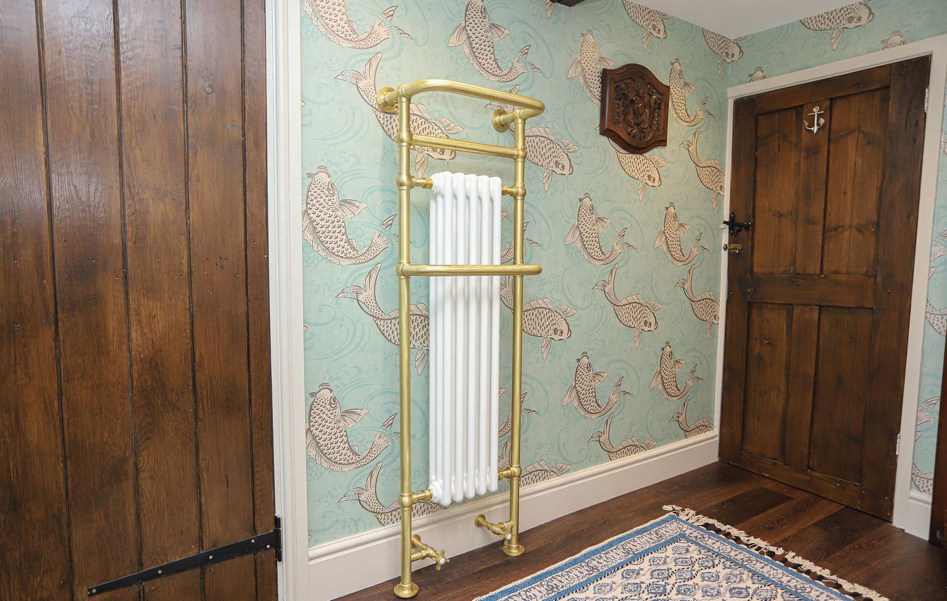 A room with a rug and a clock on the wall