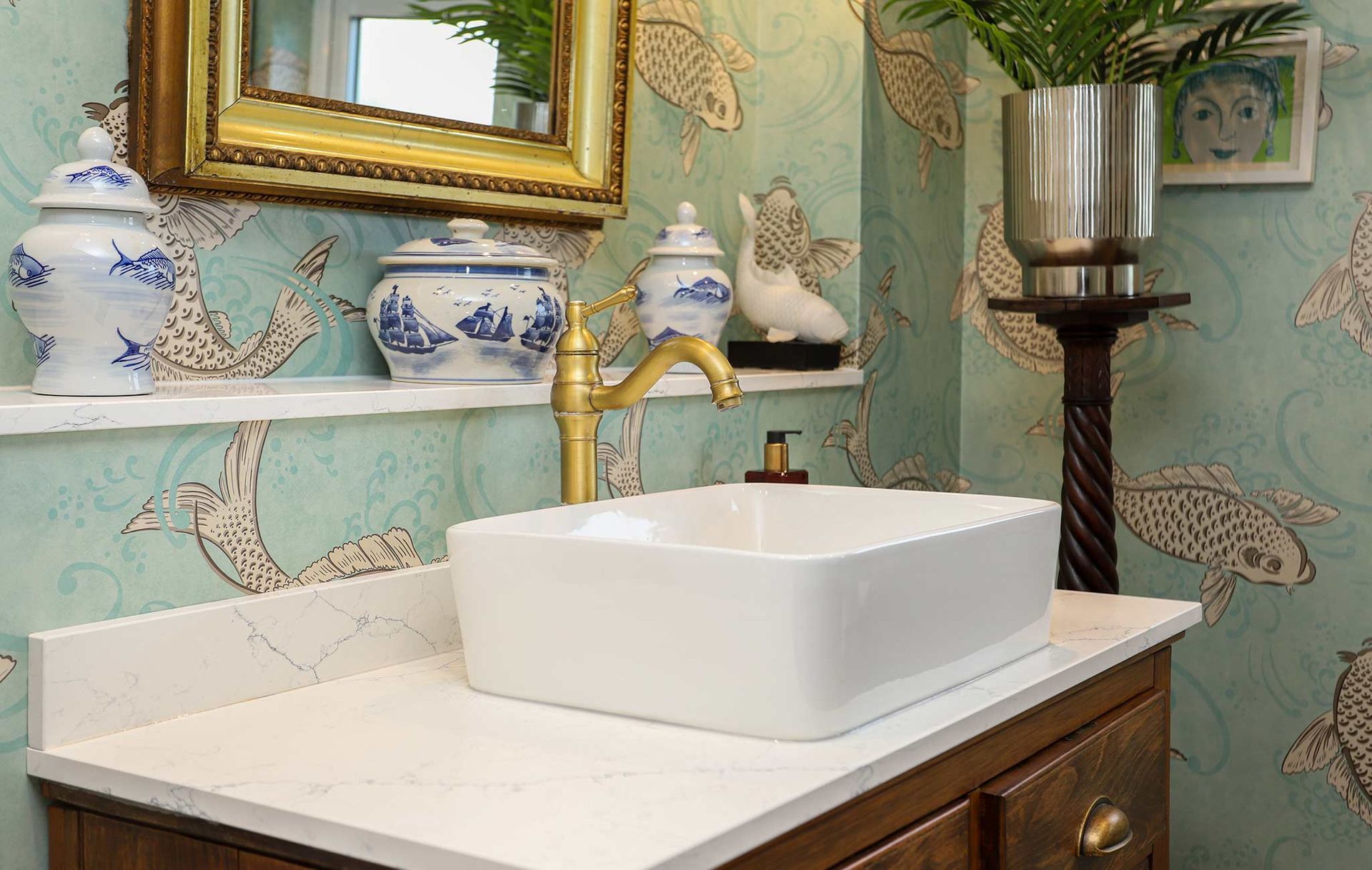 A bathroom with a sink and a mirror on the wall