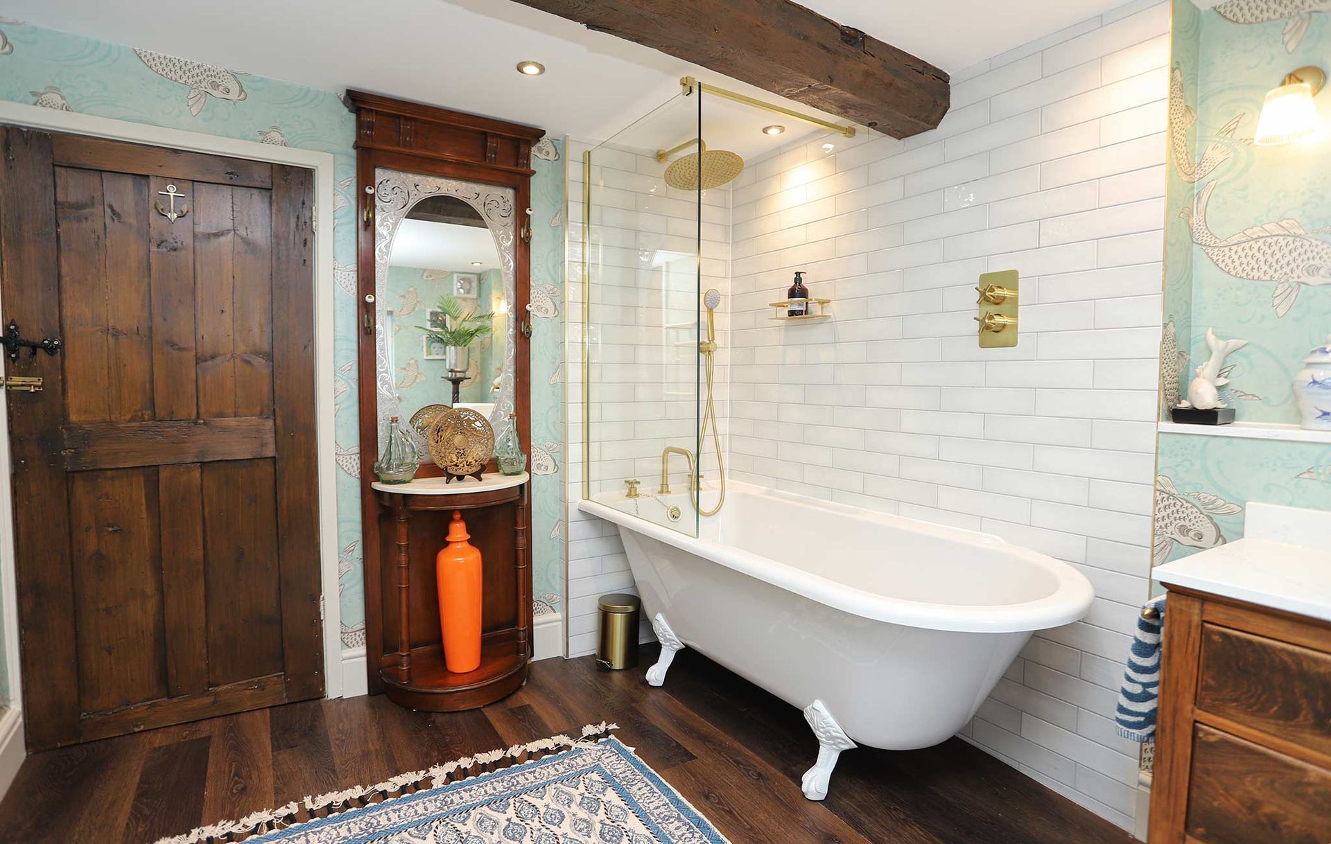 A bathroom with a claw foot tub and a mirror
