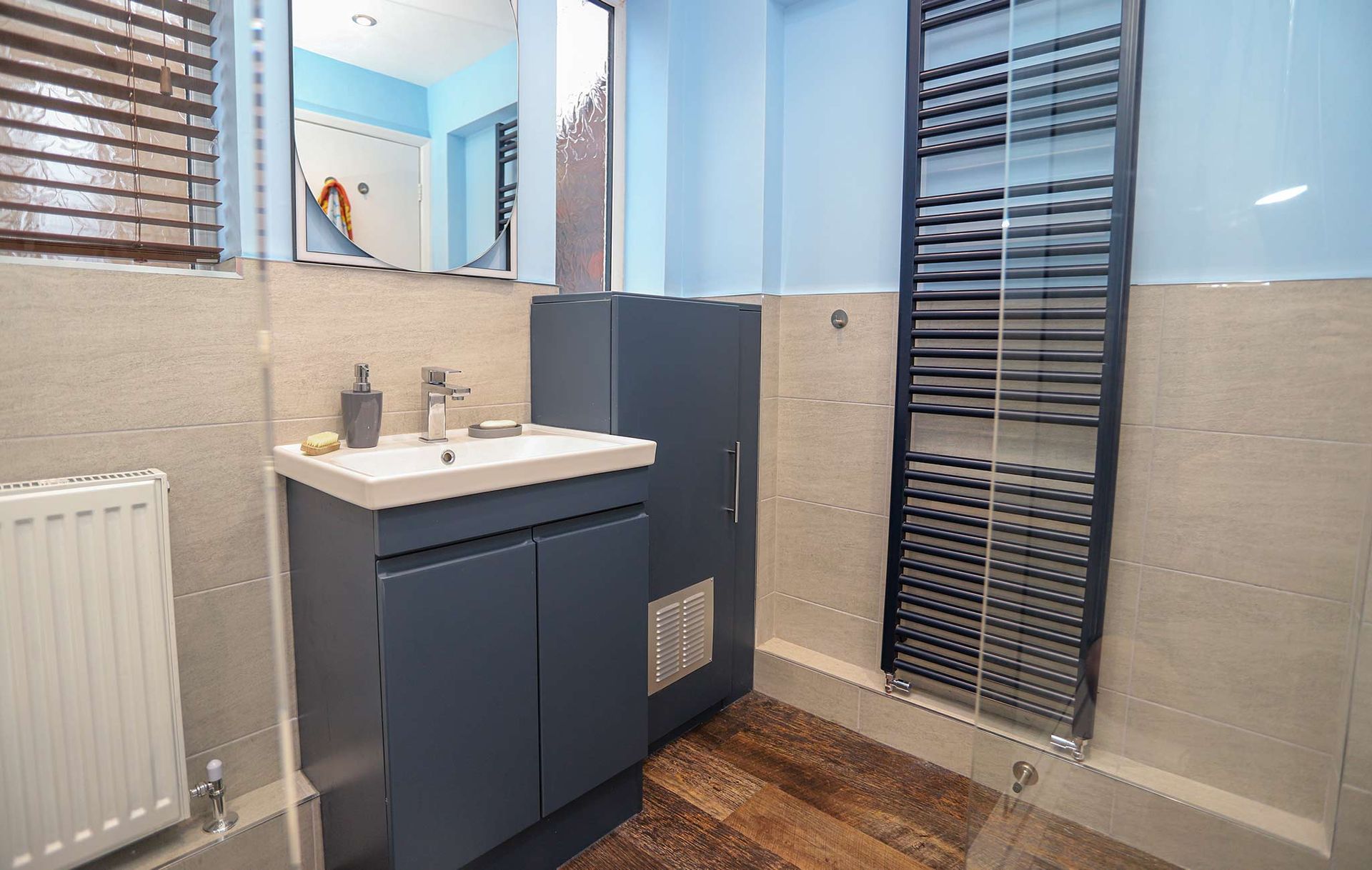 A bathroom with a sink and a towel rack